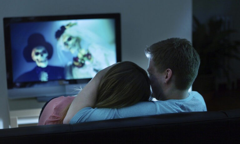 Couple Watching Scary Movie Together on TV
