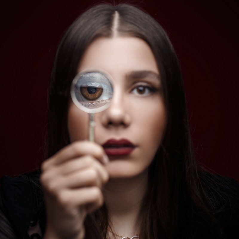 Age affects self-esteem. image of a woman magnifying her eyes