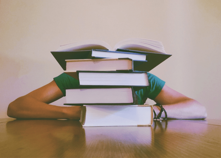 Books, Image of a man hiding on books