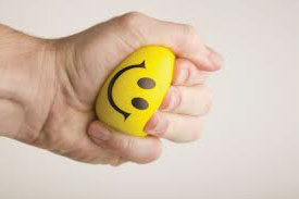 Anti-Happiness Culture, hand squishing smiley ball