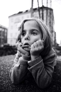 Image of bored kid, happiness is boring