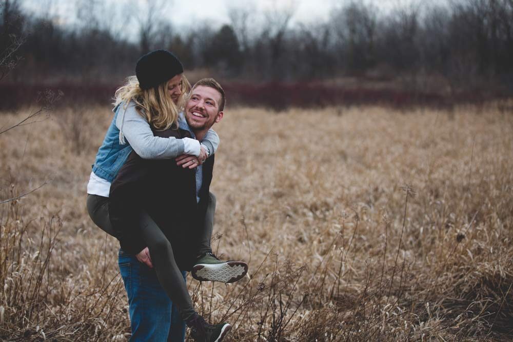 Dating apps, an image of a man lifting at his girlfriend on his back. 