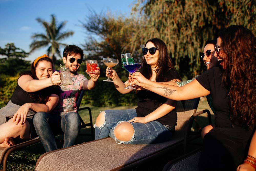 punish, an image of a group of people drinking on a sunny day. 