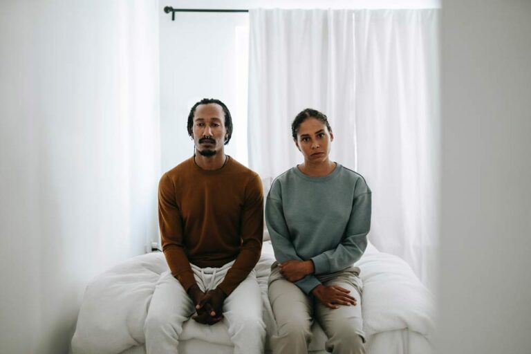 Conflict Resolution, man and woman sitting on bed