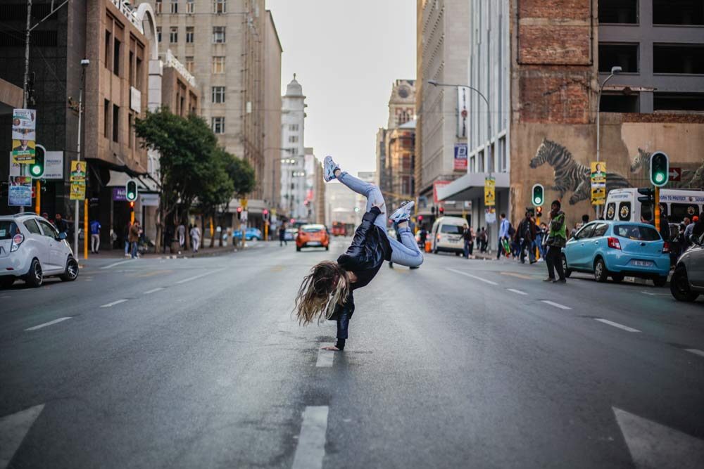 conflict resolution, a girl with two feet up at the center of the road