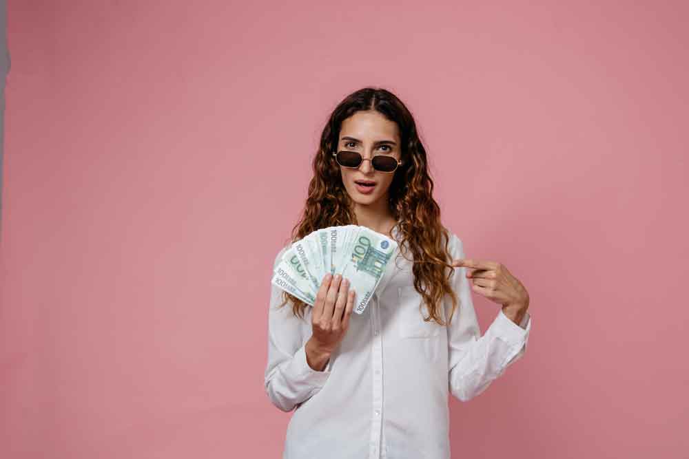 Money is enough, a woman wearing a sunglass and holding a money