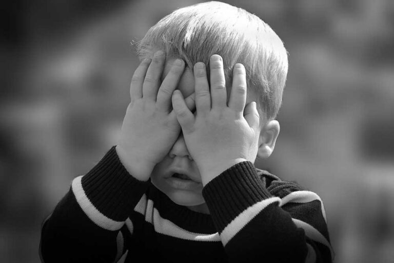 Radical Honesty, boy hiding his face